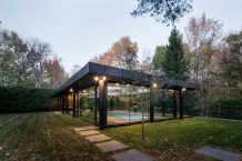 A Glass House Inspired Pavilion Houses an Indoor Swimming Pool